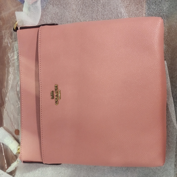 Coach Handbags - Coach crossbody bag. New with tags. Pink
